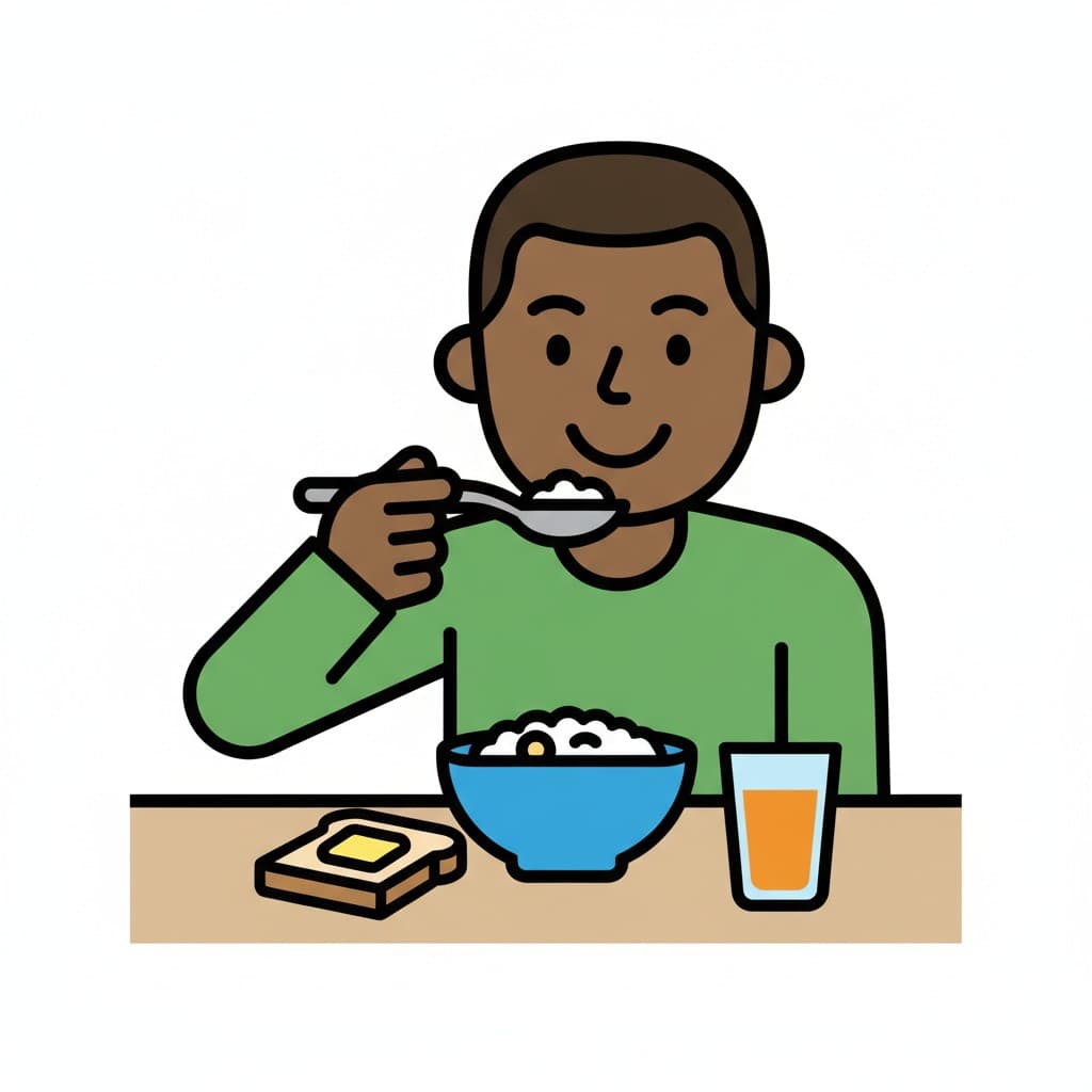 En pojke sitter vid ett bord och äter frukost, med en skål flingor, en smörgås och ett glas apelsinjuice.