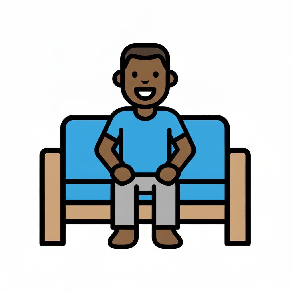 A man sits calmly on a blue couch with his hands resting on his lap.