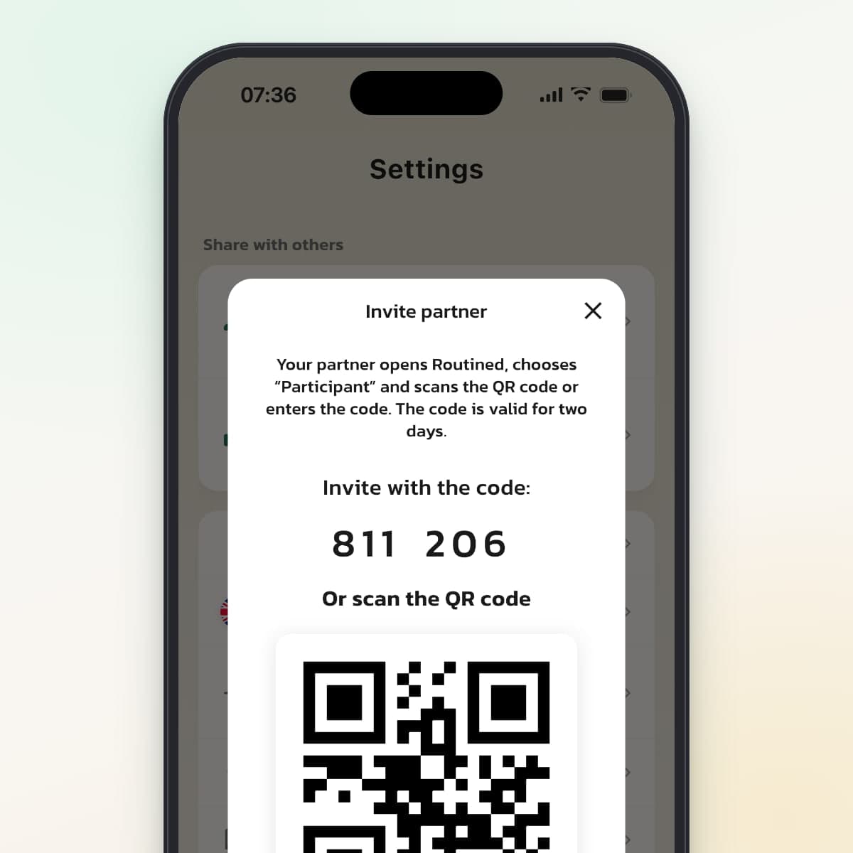 A partner invitation in Routined with a six-digit code and a QR code